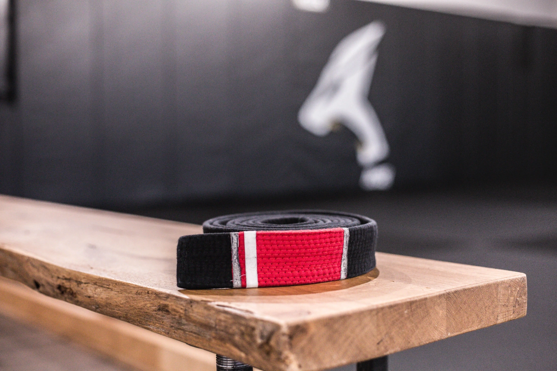 Black belt on wooden bench at Logic Jiu Jitsu